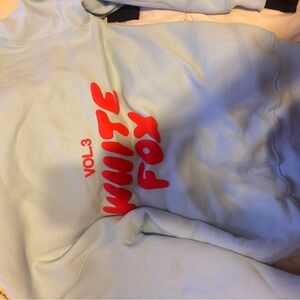 White Fox Boutique Light Blue Sweater with Red Print